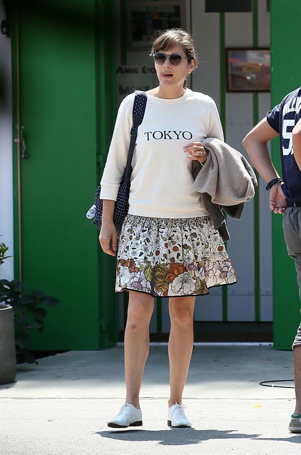 Marion Cotillard strolling down the streets of Cap-Ferret August 12, 2014