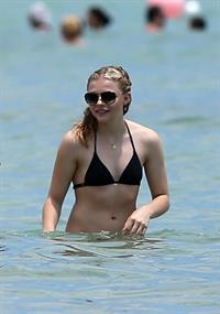 Chloe Grace Moretz candids in a Black Bikini in Miami Beach