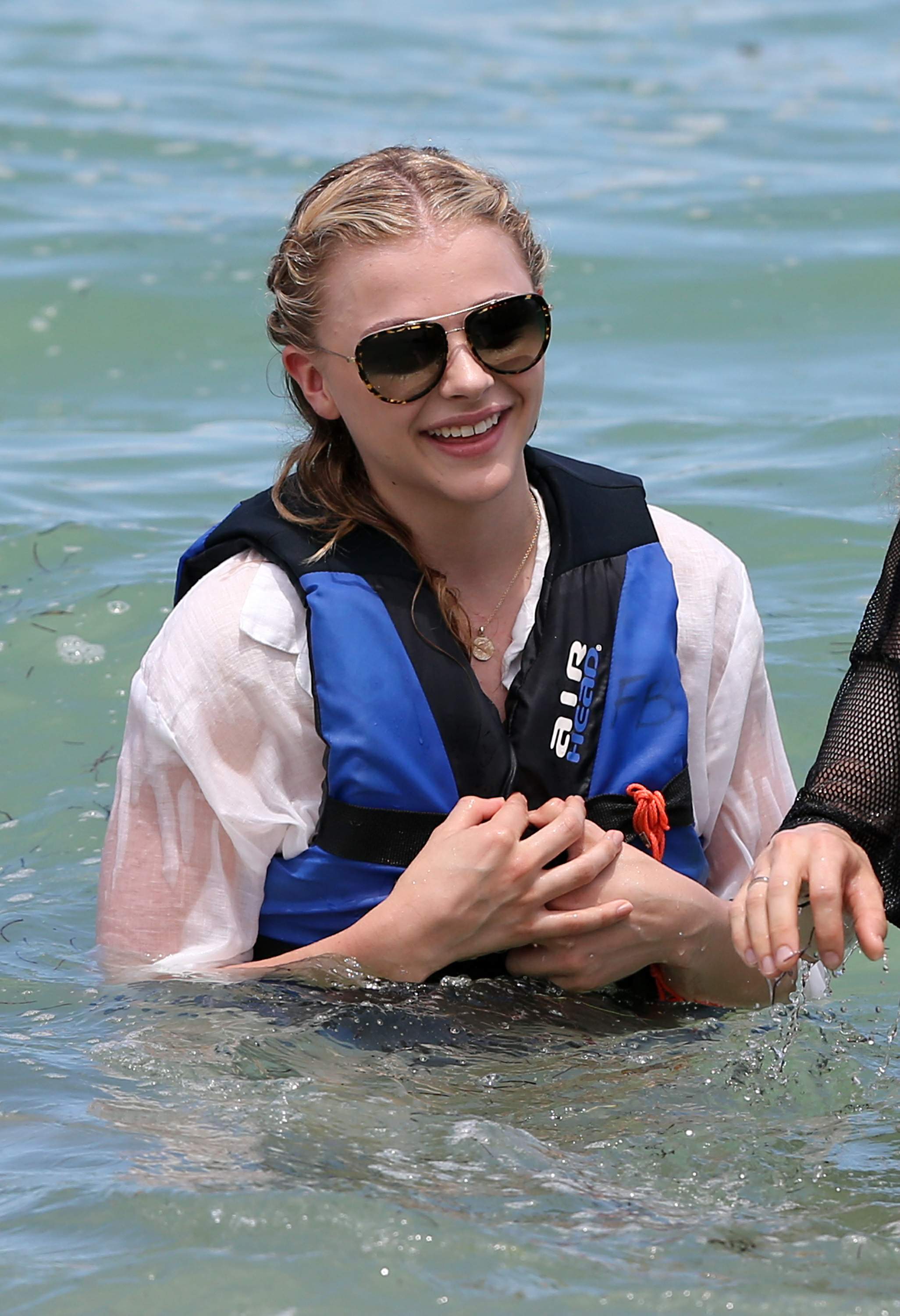 Chloe Grace Moretz candids in a Black Bikini in Miami Beach