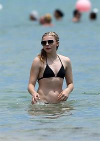 Chloe Grace Moretz candids in a Black Bikini in Miami Beach