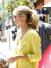 Heidi Klum out for lunch in Brentwood in a yellow shirt