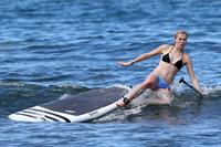 Ireland Baldwin goes paddle-boarding in Hawaii with her boyfriend Slater Trout May 26, 2013 