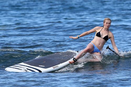 Ireland Baldwin goes paddle-boarding in Hawaii with her boyfriend Slater Trout May 26, 2013 