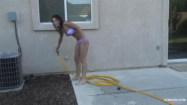 Kari Sweets having some sprinkler fun