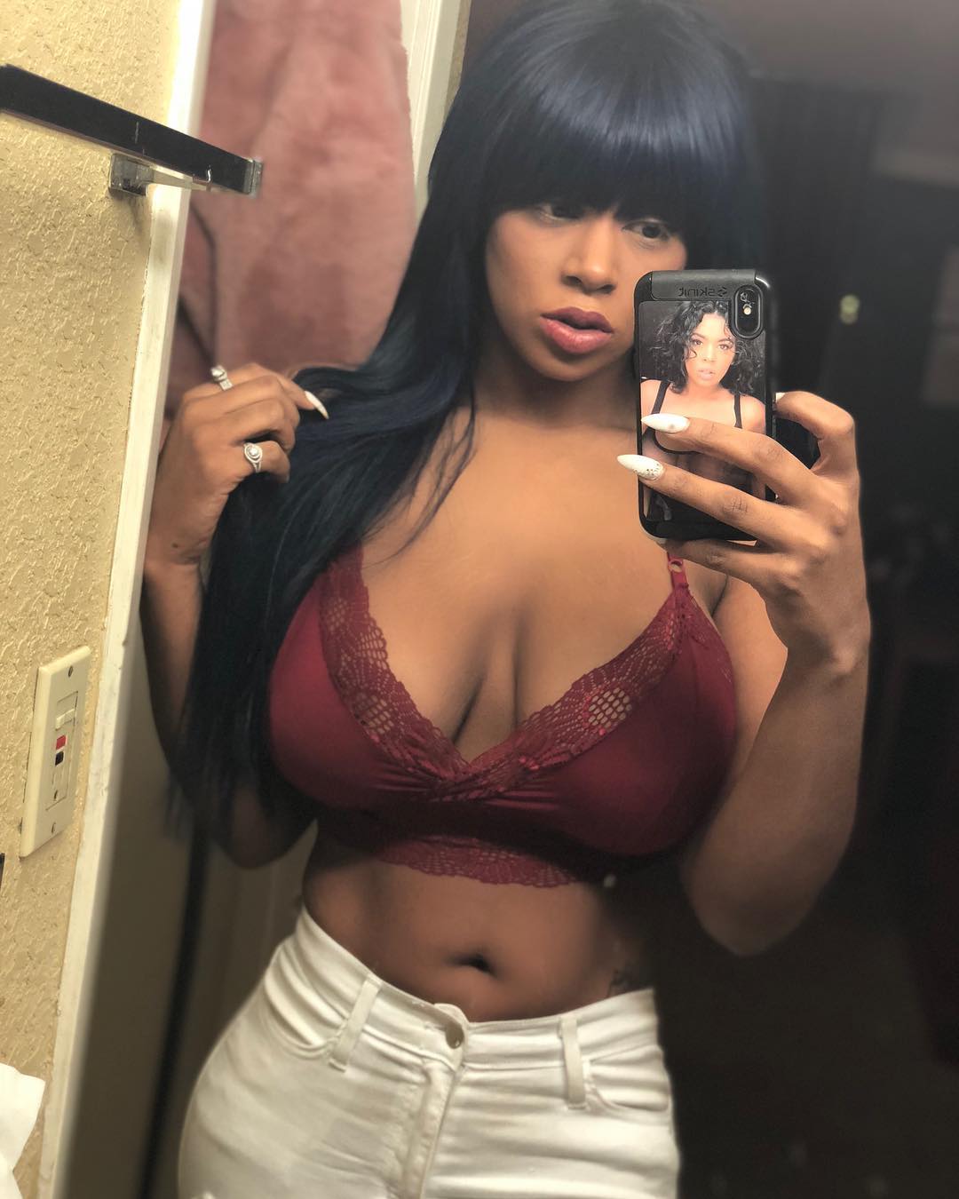 Megan Ashli in lingerie taking a selfie