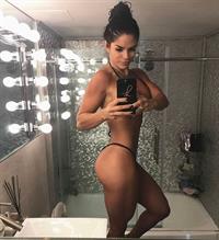 Michelle Lewin in a bikini taking a selfie