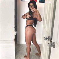 Michelle Lewin in a bikini taking a selfie