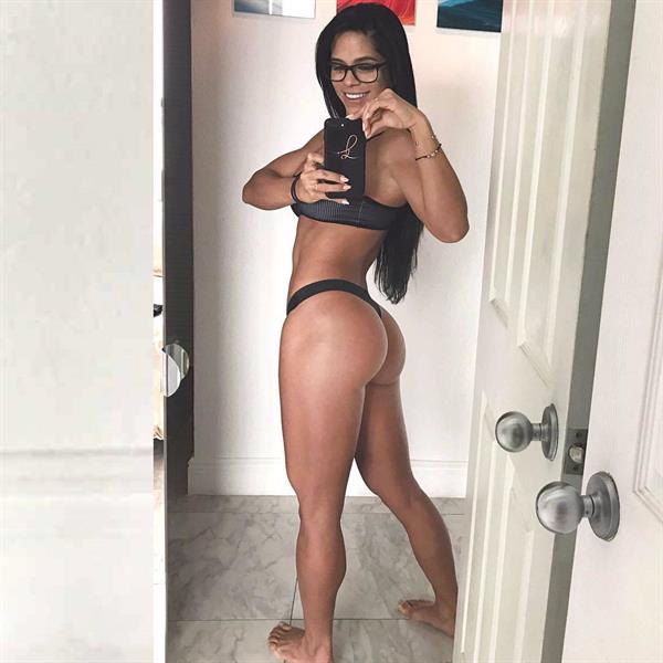 Michelle Lewin in a bikini taking a selfie