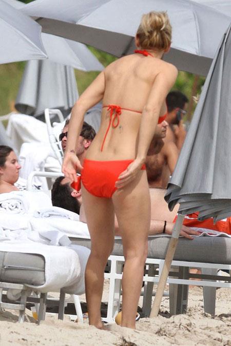 Jenny McCarthy in an orange bikini