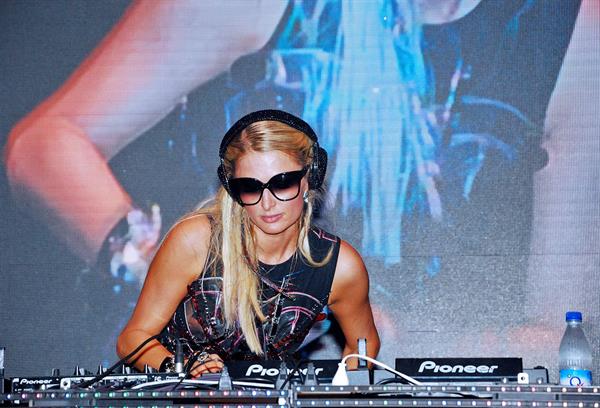 Paris Hilton walks for designer duo Shane and Falguni Peacock and performs as a DJ at the India Resort Fashion Week