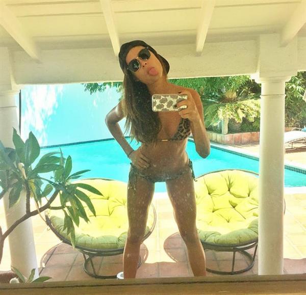 Thaila Ayala in a bikini taking a selfie