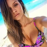 Josephine Skriver in a bikini taking a selfie