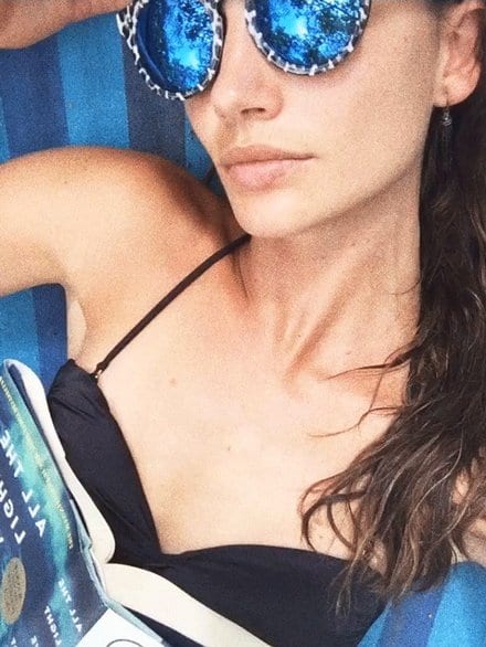 Lily Aldridge in a bikini taking a selfie