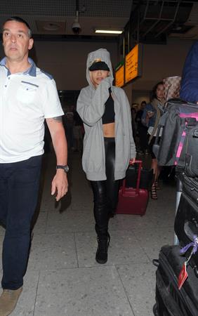 Rita Ora catches a flight at Heathrow Airport in London (27.06.2013) 