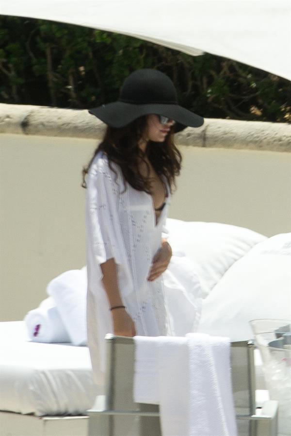 Selena Gomez in bikini by a hotel pool in Miami 5/11/13 