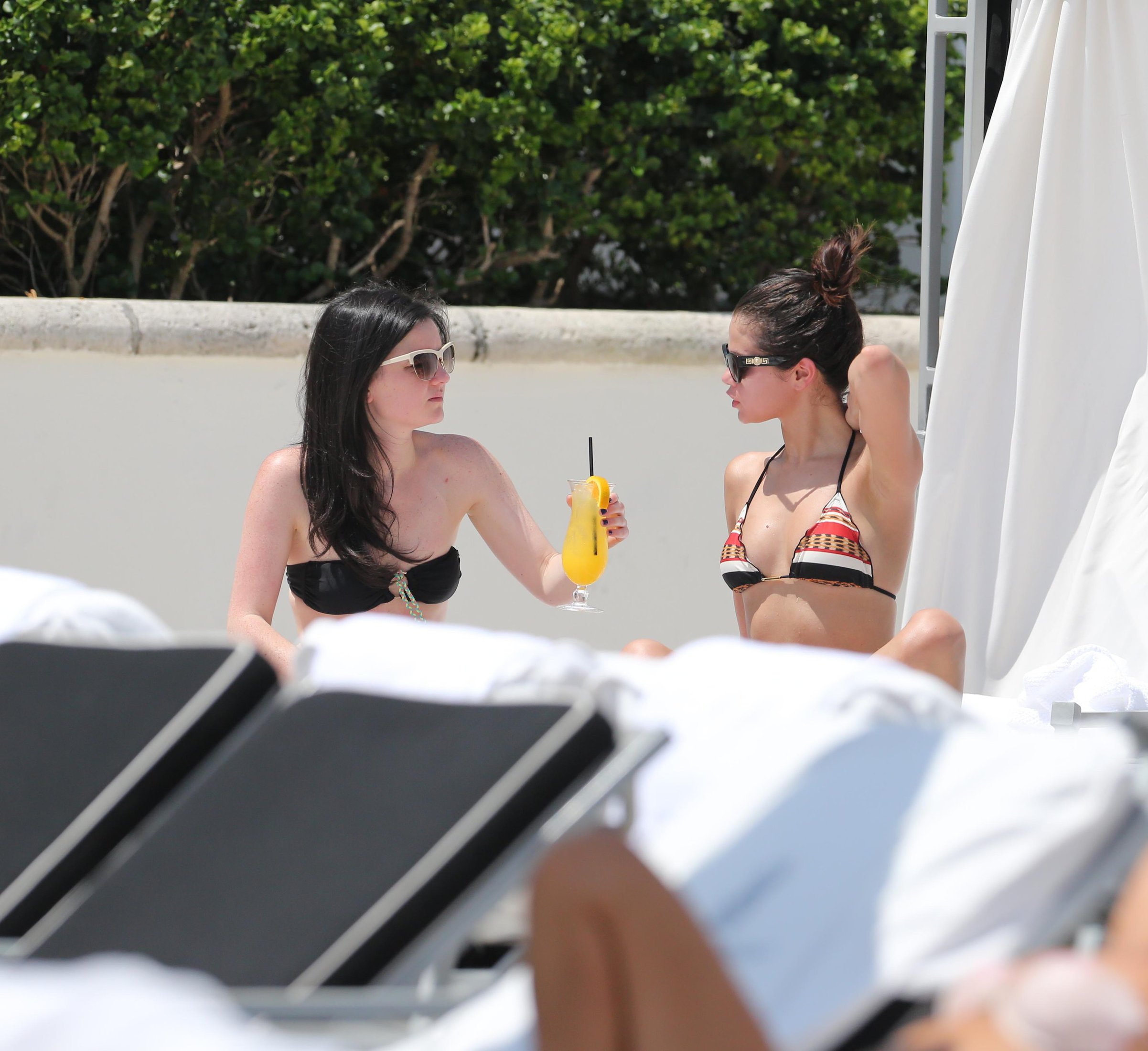 Selena Gomez in bikini by a hotel pool in Miami 5/11/13 