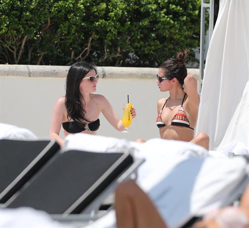 Selena Gomez Bikini Pictures Selena Gomez in bikini by a hotel pool in Miami 5/11/13