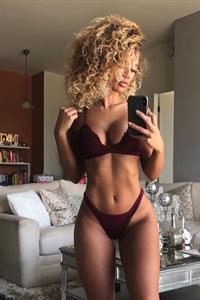 Jena Frumès in a bikini taking a selfie