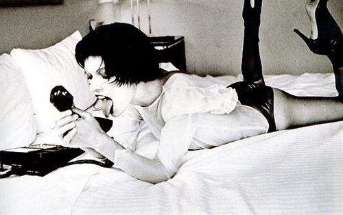 Milla Jovovich in lingerie - ass