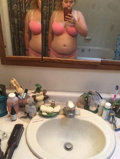 Stephanie Elliott in lingerie taking a selfie