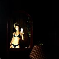 Anonymous in a bikini in lingerie taking a selfie
