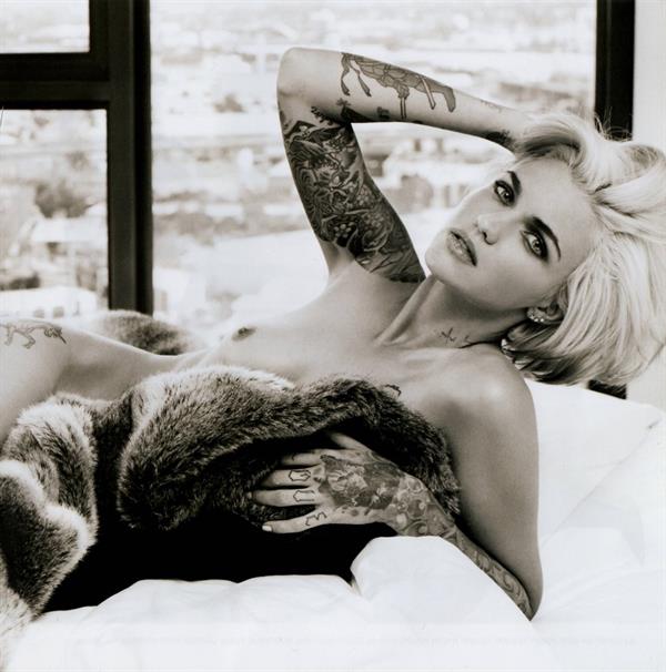 Ruby Rose nude photo shoots showing her naked tattooed body and boobs.











