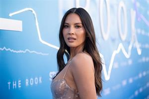 Olivia Munn cleavage in a dress at the premiere of  The Rook .


























