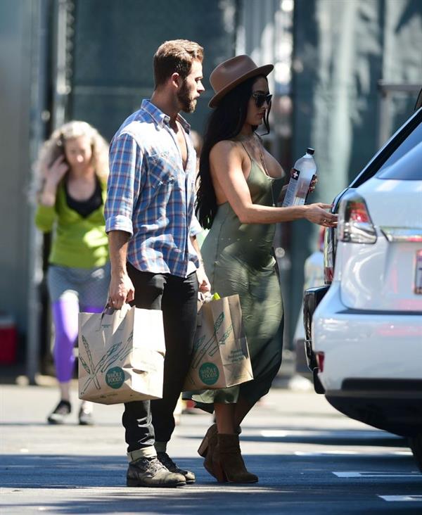 Nikki Bella braless boobs in a green dress seen by paparazzi.
















