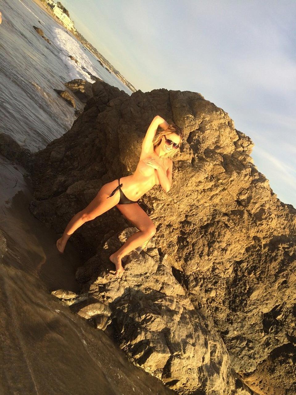 Ella Rose in a topless beach photoshoot