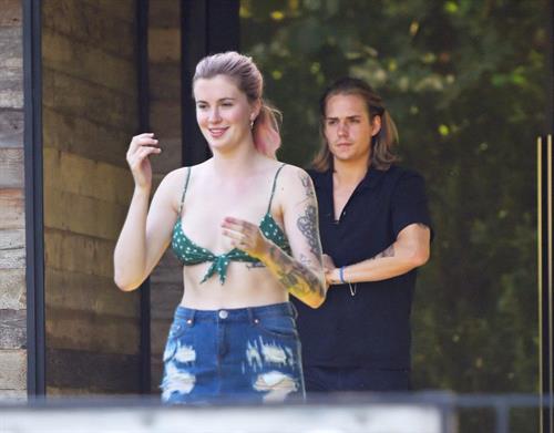 Ireland Baldwin Pictures Ireland Baldwin sexy in a bikini top seen by paparazzi showing some nice cleavage.
