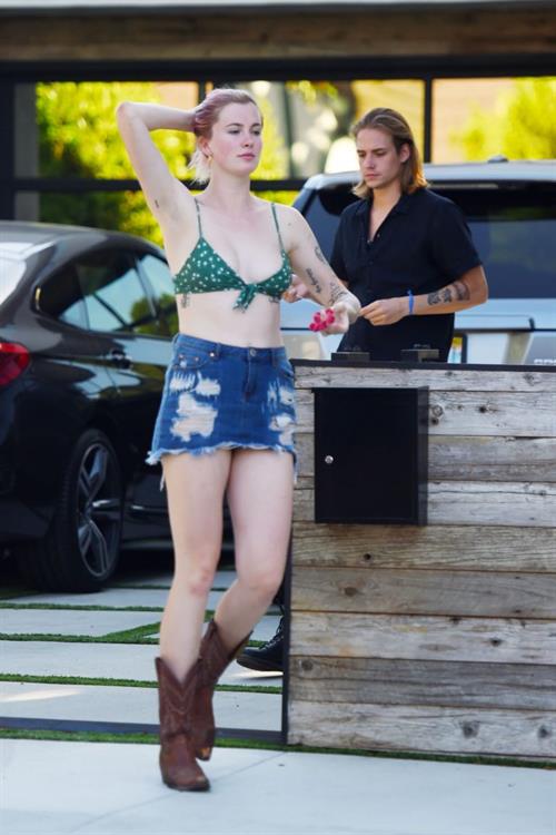 Ireland Baldwin Pictures Ireland Baldwin sexy in a bikini top seen by paparazzi showing some nice cleavage.