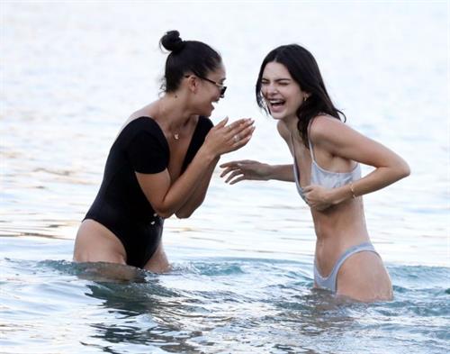 Kendall Jenner Bikini Pictures Kendall Jenner sexy ass in a thong bikini seen by paparazzi in the water at the beach.