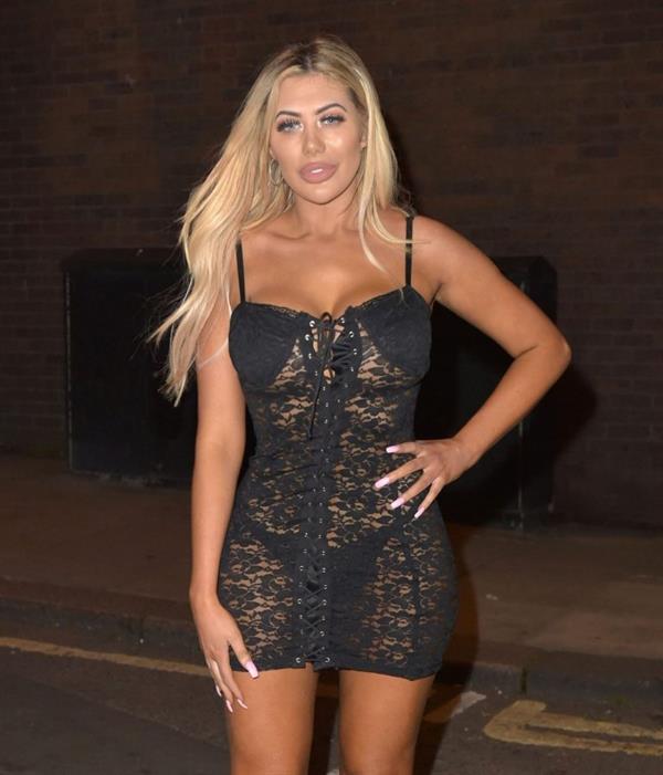 Chloe Ferry sexy revealing see through dress showing nice cleavage and ass in thong panties seen by paparazzi.

