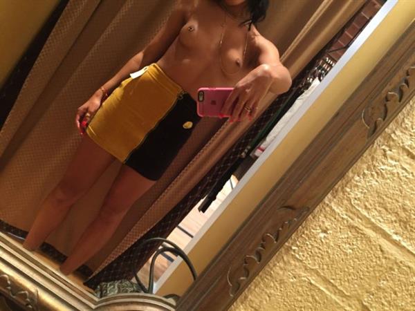 Sami Miro taking a selfie and - breasts