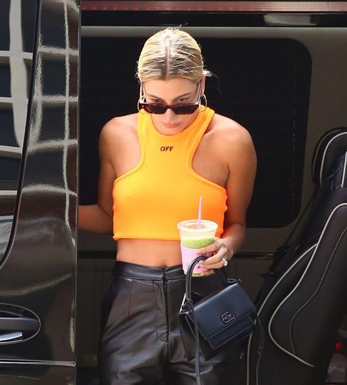 Hailey Bieber Pictures Hailey Bieber braless tits pokies seen by paparazzi in a halter top.