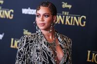 Beyonce braless boobs and areola peek showing off nice cleavage on the red carpet for the premiere of  The Lion King .






