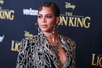 Beyonce braless boobs and areola peek showing off nice cleavage on the red carpet for the premiere of  The Lion King .






