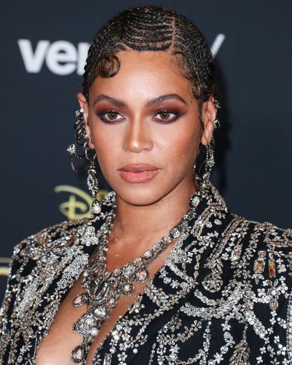 Beyonce braless boobs and areola peek showing off nice cleavage on the red carpet for the premiere of  The Lion King .






