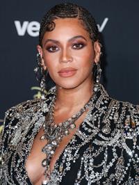 Beyonce braless boobs and areola peek showing off nice cleavage on the red carpet for the premiere of  The Lion King .






