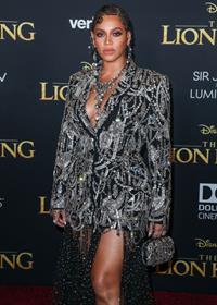 Beyonce braless boobs and areola peek showing off nice cleavage on the red carpet for the premiere of  The Lion King .







