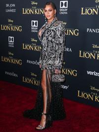 Beyonce braless boobs and areola peek showing off nice cleavage on the red carpet for the premiere of  The Lion King .






