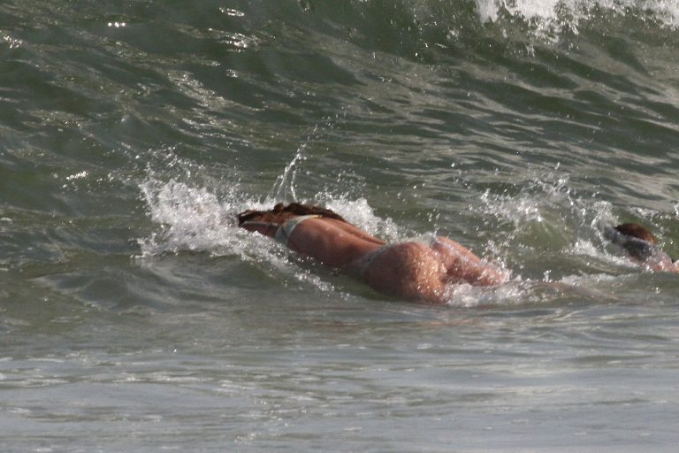 Nina Agdal Bikini Pictures Nina Agdal sexy ass in a thong bikini at the beach with her boyfriend seen by paparazzi.