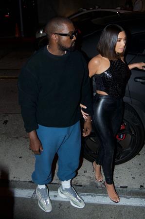 Kim Kardashian sexy in a tight leather outfit seen by paparazzi with her husband Kanye West.














