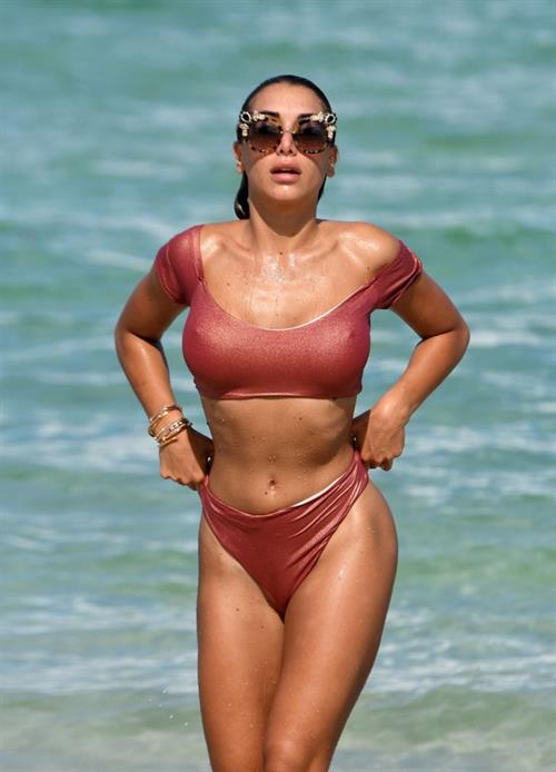 Elisa De Panicis sexy tits pokies and ass in a thong bikini seen by paparazzi.




