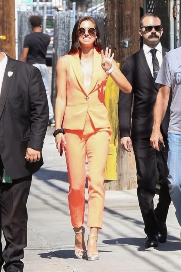 Alex Morgan braless and sexy in a orange jacket seen by paparazzi.








