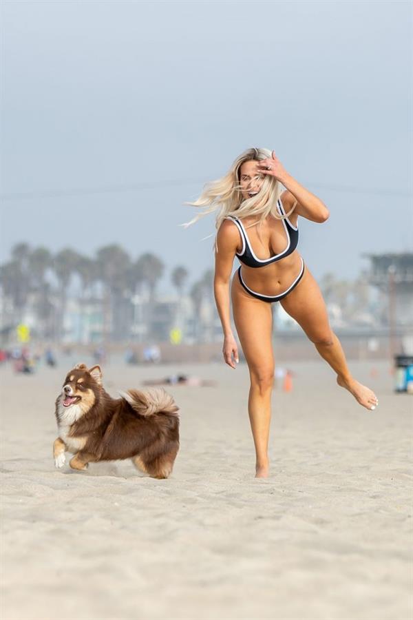 WWE Diva Lana or CJ Perry sexy boobs and ass in a bikini seen at the beach by paparazzi.










