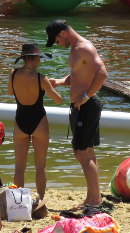 Elsa Pataky Bikini Pictures Elsa Pataky sexy ass and cleavage in a swimsuit seen by paparazzi with Chris Hemsworth.