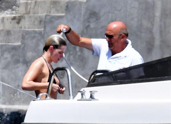 Kristen Stewart nude boobs caught topless by paparazzi tanning on a boat.
