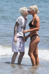 Gigi Gorgeous sexy cleavage in a bikini at the beach with Nats Getty seen by paparazzi.



