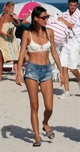 Kelsey Merritt sexy bikini body seen at the beach by paparazzi with Olivia Brower.
